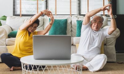 Woman and man exercise at home