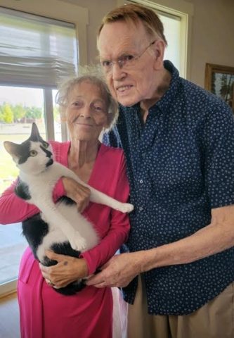 Howard and Dorothy Mosely pose with their cat