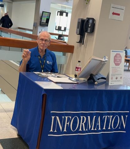 Phil Cahoon volunteering at information desk