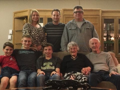 Agnes Wood and family posing for a group photo at home during Thanksgiving