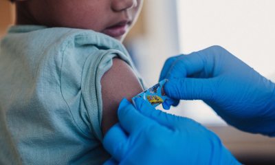 Young child getting a vaccine.