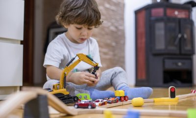 Toddler playing with his toys.