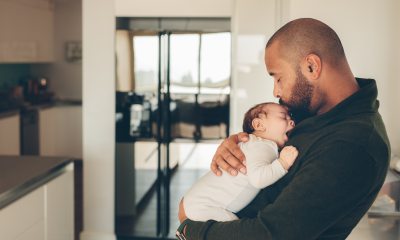 Man holding newborn baby