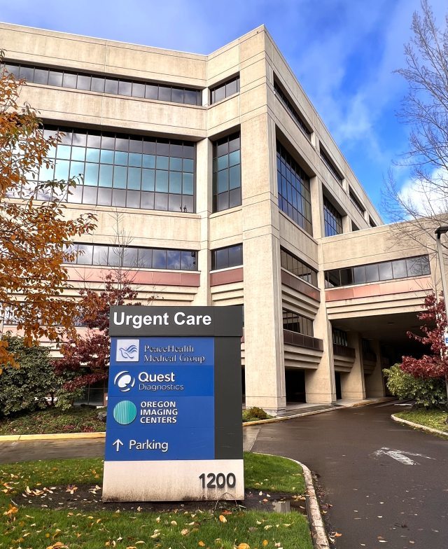 Photo of a sign for urgent care clinic in front of a building