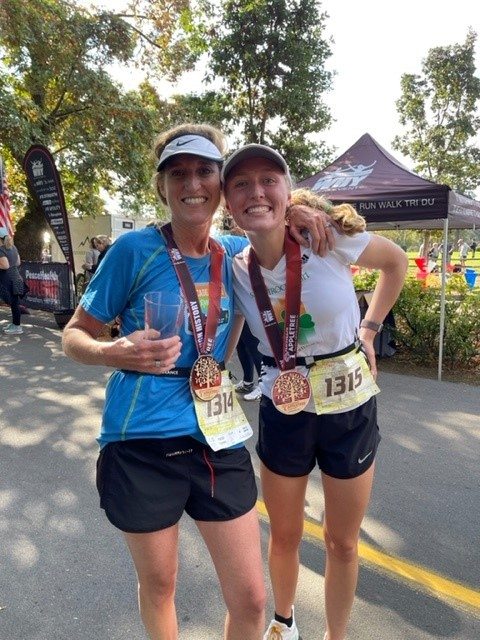 PeaceHealth caregiver Tara Twing poses with her daughter at the APPLETREE finish line.