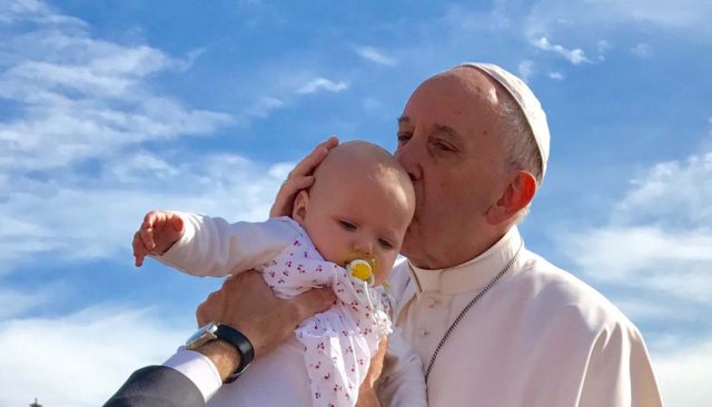 Pope Francis blesses baby